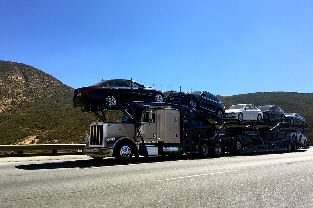 A commercial auto transport truck typically hauls 5-10 cars at a time.