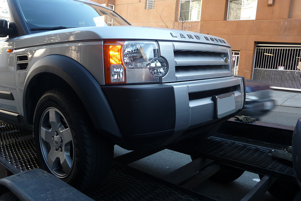 a car getting shipped in a residential neighborhood in Albuquerque New Mexico